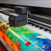 Large format printing machine in operation. Industry